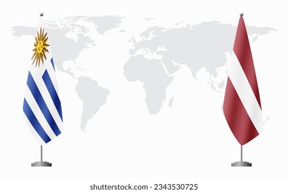 Uruguay and Latvia flags for official meeting against background of world map.