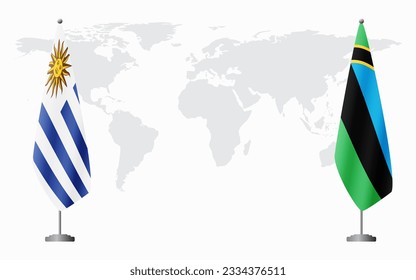 Uruguay and Zanzibar flags for official meeting against background of world map.