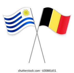Uruguayan and Belgian crossed flags. Uruguay combined with Belgium isolated on white. Language learning, international business or travel concept.