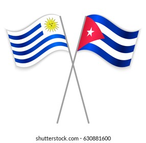 Uruguayan and Cuban crossed flags. Uruguay combined with Cuba isolated on white. Language learning, international business or travel concept.