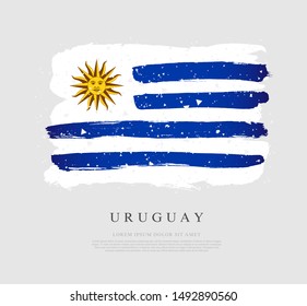 Uruguayan flag. Vector illustration on a gray background. Brush strokes are drawn by hand. Uruguay Independence Day.