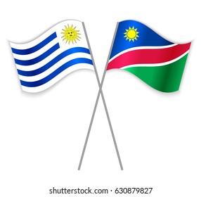 Uruguayan and Namibian crossed flags. Uruguay combined with Namibia isolated on white. Language learning, international business or travel concept.