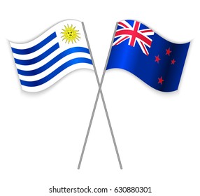 Uruguayan and NZ crossed flags. Uruguay combined with New Zealand isolated on white. Language learning, international business or travel concept.