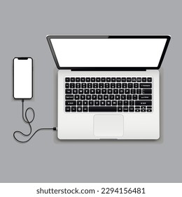 USB cable connects phone and laptop