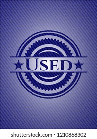 Used badge with denim background