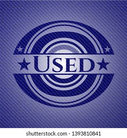 Used badge with denim background. Vector Illustration. Detailed.
