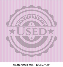 Used badge with pink background
