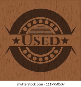 Used badge with wooden background