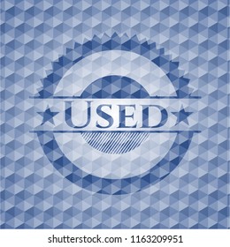 Used blue emblem with geometric pattern.