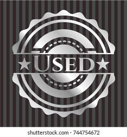 Used silvery shiny badge