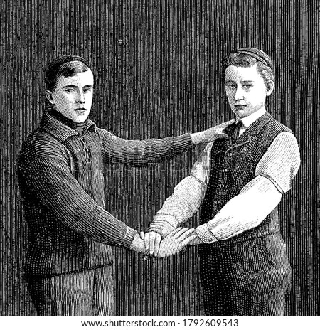 The useful three-handed seat is made by one bearer grasping the free wrist of the other bearer and placing his free hand on his partner's shoulder, in order to support the patient's back, vintage