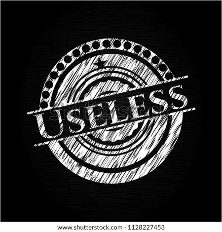 Useless chalk emblem written on a blackboard