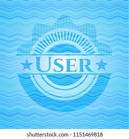 User light blue water wave badge.