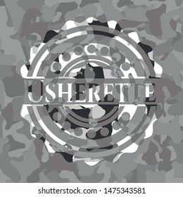 Usherette on grey camouflaged texture