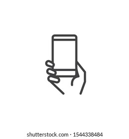 Using mobile gadget line icon. linear style sign for mobile concept and web design. Hand with smartphone outline vector icon. Symbol, logo illustration. Vector graphics