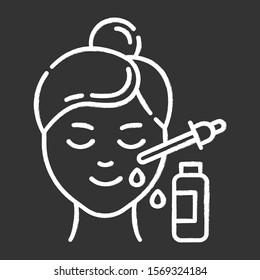 Using serum chalk icon. Skin care procedure. Facial beauty treatment. Lifting and exfoliating effect. Oil product for skin. Dermatology, cosmetics, makeup. Isolated vector chalkboard illustration