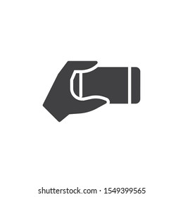 Using smartphone vector icon. filled flat sign for mobile concept and web design. Hand holding mobile phone glyph icon. Symbol, logo illustration. Vector graphics