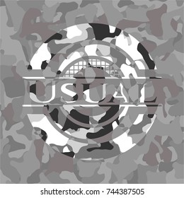 Usual written on a grey camouflage texture