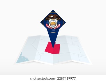 Utah is depicted on a folded paper map and pinned location marker with flag of Utah. Folded vector map.