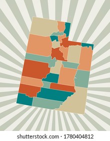 Utah map. Poster with map of the us state in retro color palette. Shape of Utah with sunburst rays background. Vector illustration.