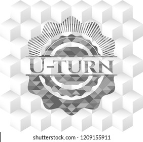 U-turn grey badge with geometric cube white background