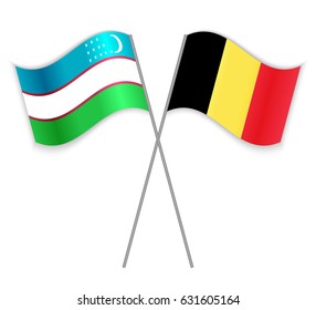 Uzbek and Belgian crossed flags. Uzbekistan combined with Belgium isolated on white. Language learning, international business or travel concept.