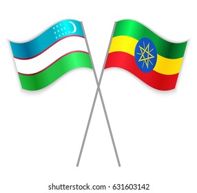 Uzbek and Ethiopian crossed flags. Uzbekistan combined with Ethiopia isolated on white. Language learning, international business or travel concept.