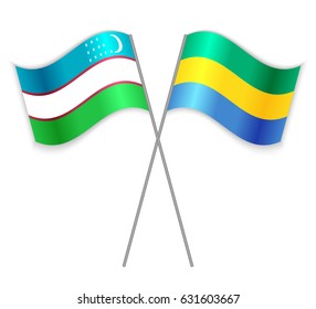 Uzbek and Gabonese crossed flags. Uzbekistan combined with Gabon isolated on white. Language learning, international business or travel concept.
