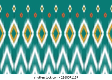 Uzbek ikat pattern-traditional silk fabric in Uzbekistan. Handmade textile product. Traditional pattern on the fabric in Indonesia and other Asian countries