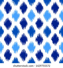 Uzbek ikat silk fabric pattern, indigo blue and white colors. Seamless geometric pattern, based on ikkat fabric style. Vector illustration. Carpet rug texture vector imitation.