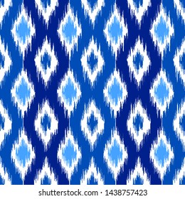 Uzbek ikat silk fabric pattern, indigo blue and white colors. Seamless geometric pattern, based on ikkat fabric style. Vector illustration. Carpet rug texture vector imitation.