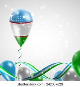 Uzbekistan flag on balloon. Celebration and gifts. Ribbon in the colors are twisted. Balloons on the feast of the national day. 