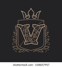 V letter logo consisting of floral pattern letters in a heraldic shield with crown. Can be used for security, hotel, resort, restaurant, boutique, jewelry, interior and fashion industry.