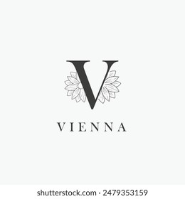 Logo de la letra V con un concepto floral creativo para el Vector premium de los bienes raíces de la belleza del negocio de la compañía