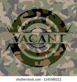 Vacant written on a camouflage texture