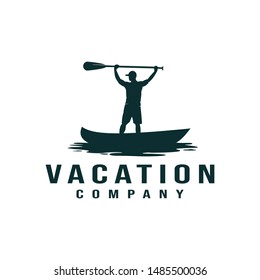 Vacation, kayak, canoe logo with a people standing up carrying a paddle