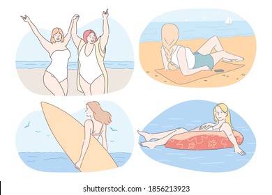 Vacations, traveling, summer holidays near sea concept. Young women in bikini sunbathing, swimming, surfing, relaxing and enjoying vacations on sea or ocean in summer during weekend 