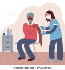 Vaccination procedure. Caucasian female nurse administering a vaccination shot to a patient. Young woman doctor in a face mask holding a syringe and a elderly African man with outstretched arm. 