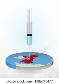 Vaccination of United Kingdom, injection of a syringe into a map of United Kingdom. Vector illustration of a syringe with vaccine and map.