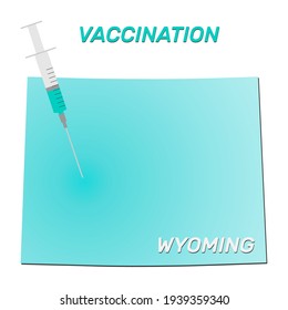 Vaccination of Wyoming. Coronavirus vaccine concept, syringe of vaccine and needle planting on Wyoming map.