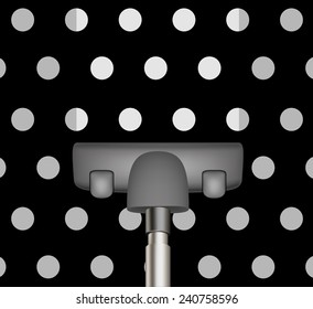 Vacuum cleaner drains black carpet with white dots