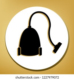 Vacuum Cleaner sign. Vector. Black icon with light brown shadow in white circle with shaped ring at golden background.
