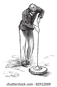 Vacuum cleaner or Vacuum, vintage engraving. Old engraved illustration of man using a vacuum cleaner. Trousset encyclopedia (1886 - 1891).
