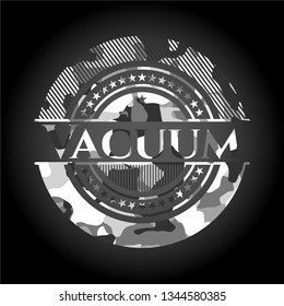 Vacuum on grey camouflage texture