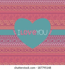Valentine card with ethnic textile decorative native ornamental striped seamless pattern with fish in vector. Ornamental card with text i love you in the shape of heart.