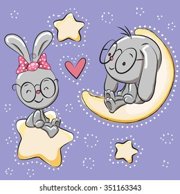 Valentine card with Lovers Rabbits on a moon and star
