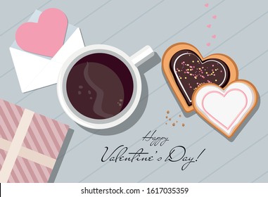 Valentine card, mug with coffee, gift and heart shaped cookies. Top view. Valentine's day.
