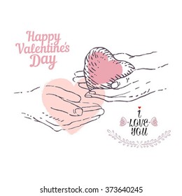 Valentine concept. A pair of hands holds a heart