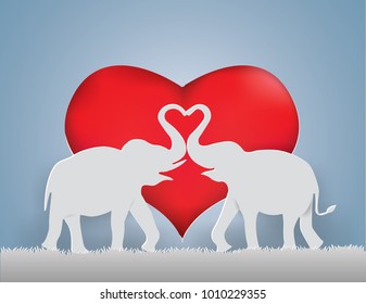 Valentine Day Concept,Elephants show the Love on the gray grass with heart background,paper craft style.