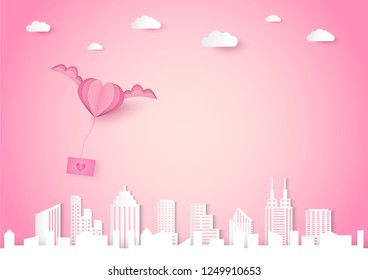 Valentine day vector background with pink heart shape and wing, love and cityscape concept, paper cut design